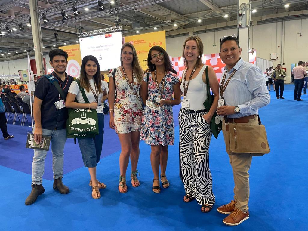 Isabel, Paola, and Emma at the World of Coffee conference